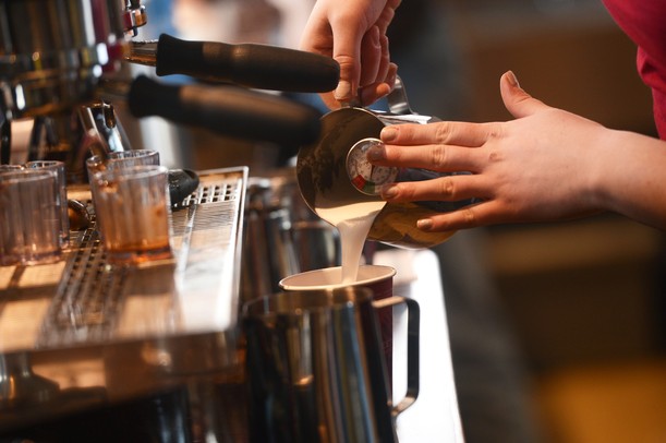 Sweetwaters general managers Julie Depowski pours steamed milk into a hot chocolate during the grand opening of a new location at 735 W. Cross St. in Ypsilanti on Tuesday, March 19, 2013. Melanie Maxwell I AnnArbor.com